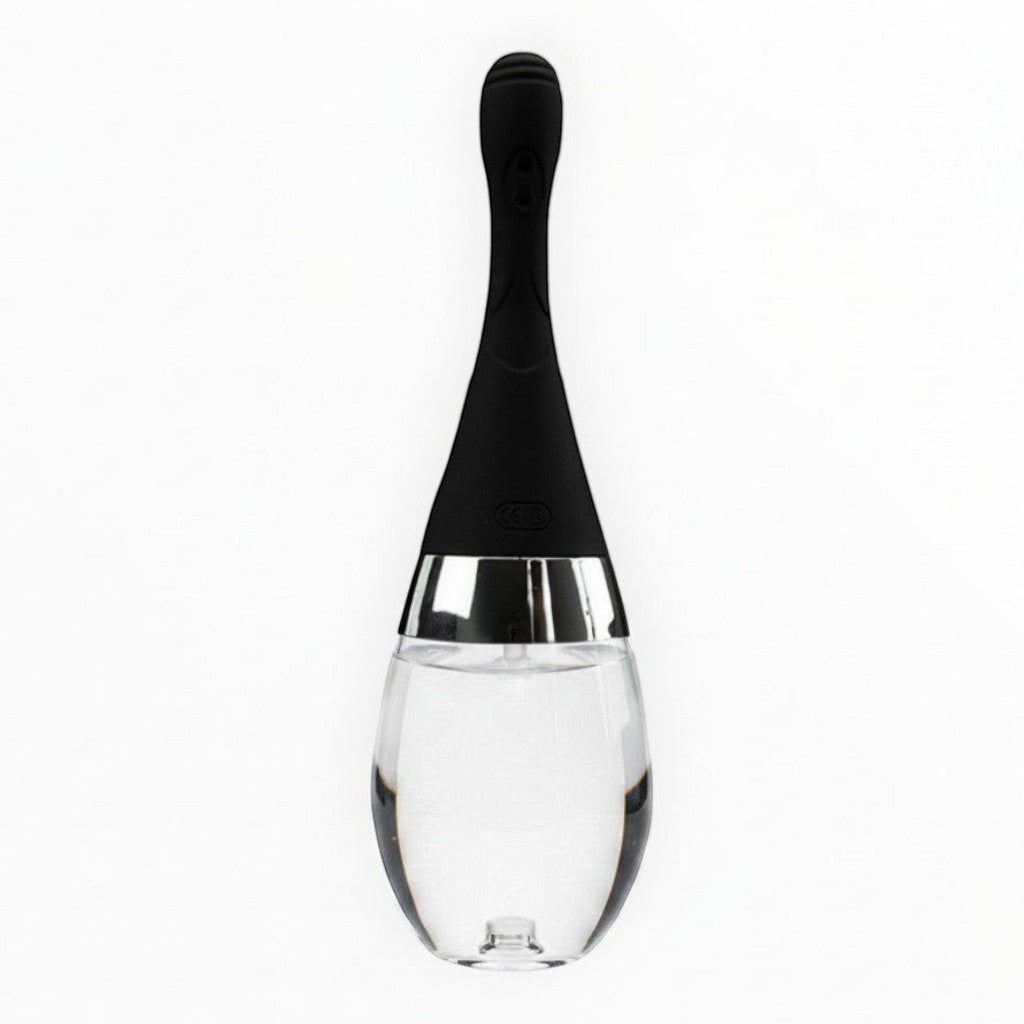 NCPARTIES LLC Cleanze personal cleansing device with a black silicone handle and a clear glass bulb base.
