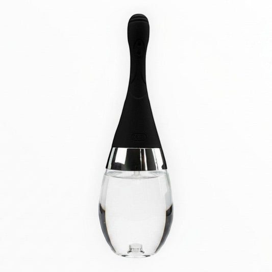 NCPARTIES LLC Cleanze personal cleansing device with a black silicone handle and a clear glass bulb base.